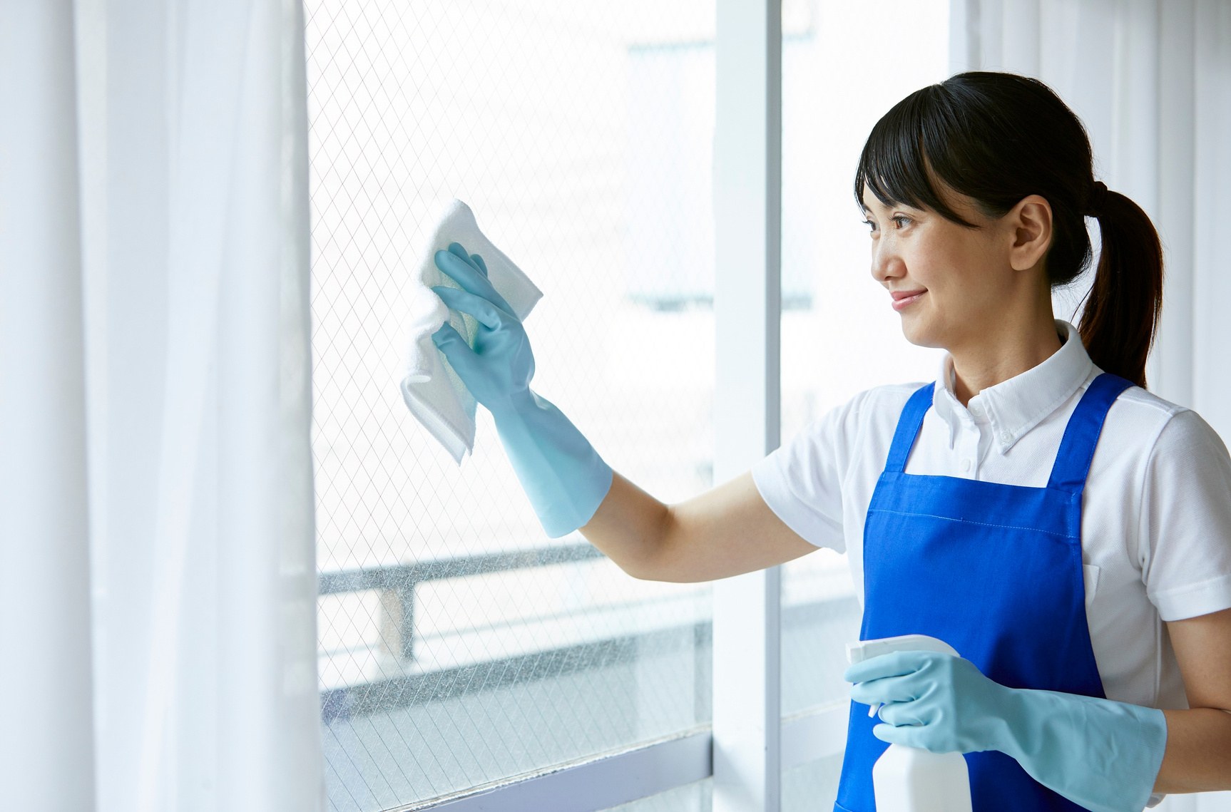 TRUST janitorial staff cleaning windows